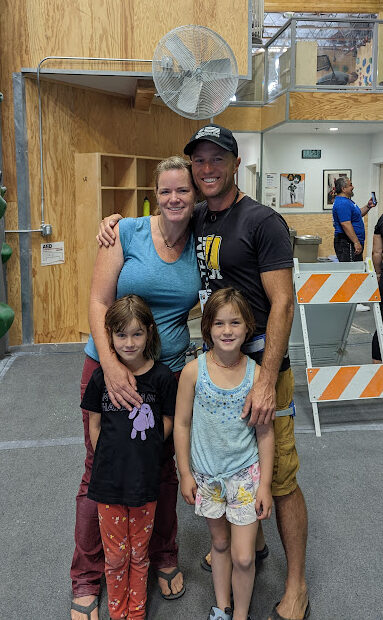A woman, her husband and two children at The Pad Climbing gym