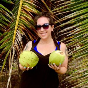 Woman holding two coconuts in both hands