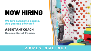 Recreational Teams Assistant Coach - coach assists child on colorful climbing wall